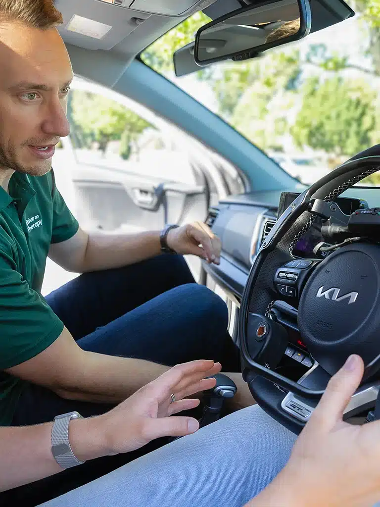 Occupational therapist providing driver training with vehicle modifications for people with disabilities.
